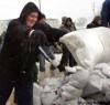 WAYNE GLOWACKI / WINNIPEG FREE PRESS
David Block, a grade 9 student along with fellow students from Elmwood High School, joined volunteers making a sandbag dike to protect the La Salle Hotel on Nairn Avenue along the Red River.