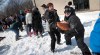 PHIL HOSSACK / WINNIPEG FREE PRESS
Volunteers pass sandbags at Audra and Trent Goodbrandson's home.