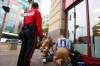 TREVOR HAGAN / WINNIPEG FREE PRESS ARCHIVES
Downtown Biz outreach worker Lisa McIntyre watches as two First Responders check on a 46-year-old man in need of medical attention.