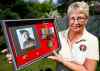 Carol Hadley holds a photo of her father Sgt Borge Agerbak who fought with the Winnipeg Grenadiers. (Trevor Hagan / Winnipeg Free Press)