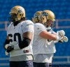 DAVID LIPNOWSKI / WINNIPEG FREE PRESS
Even the Big Blue hogs were wearing play cards at practice Wednesday afternoon at Canad Inns Stadium.