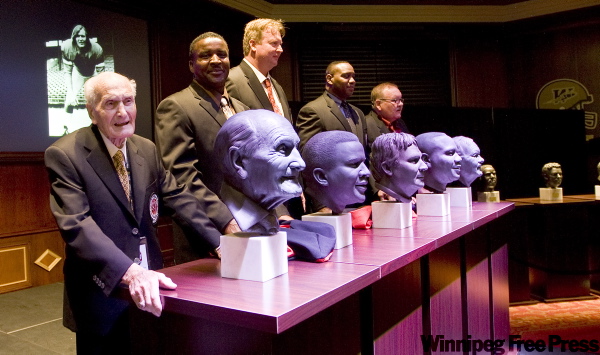 PHIL.HOSSACK@FREEPRESS.MB.CA
Ninety-one-year-old Tony Anselmo, Alondra Johnson, Jim Mills, Rudy Phillips and Glen Weir (from left) stand behind their newly unveiled busts Friday.