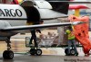KEN GIGLIOTTI / WINNIPEG FREE PRESS
A Perimeter Airways worker in Winnipeg loads flu kits onto one of several planes bound for northern First Nations Wednesday.