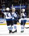 AP Photo/Kathy Kmonicek
Winnipeg Jets defenseman Jacob Trouba (8), defenseman Mark Stuart (5) and center Alex Burmistrov (6) celebrate Stuart's empty net goal against the New York Rangers during the third period.