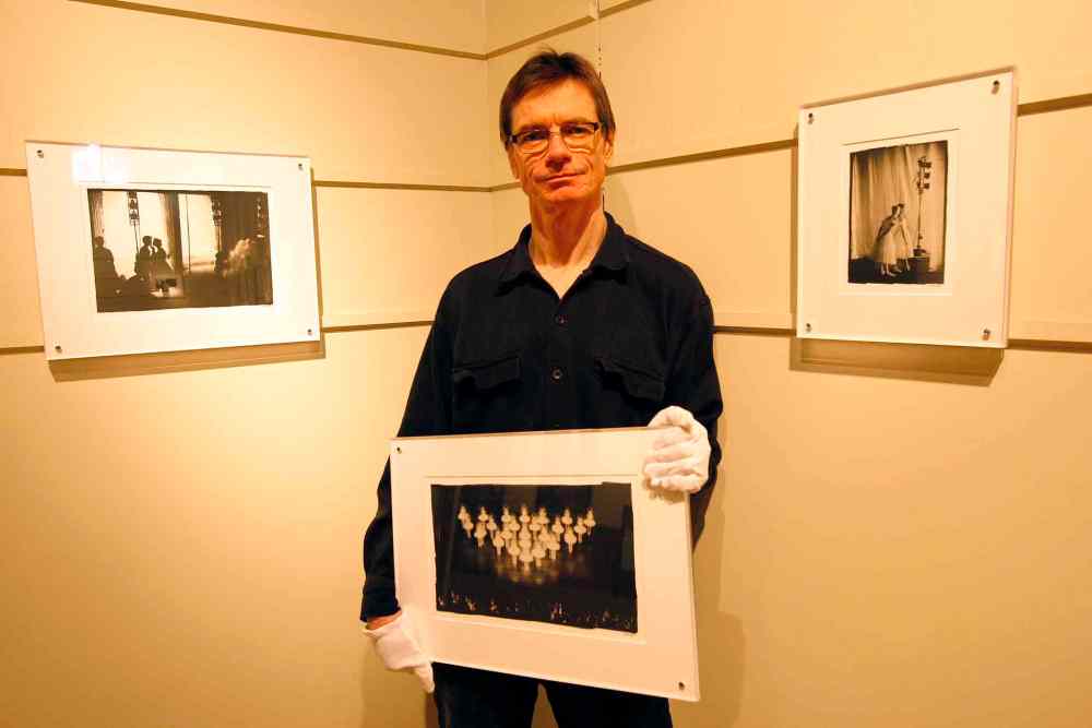 Ken Gigliotti / Winnipeg Free Press files
In this file photo from 2010, Bruce Monk shows his platinum prints of behind-the-scenes pictures of RWB dancers and crew.