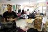 MIKE.DEAL@FREEPRESS.MB.CA
Leah McGuiness and other volunteers sort through donated clothing for flood-affected families.