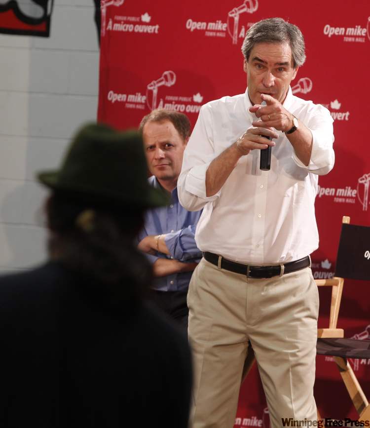 BORIS.MINKEVICH@FREEPRESS.MB.CA
Michael Ignatieff (foreground) takes a question during town hall session Thursday.