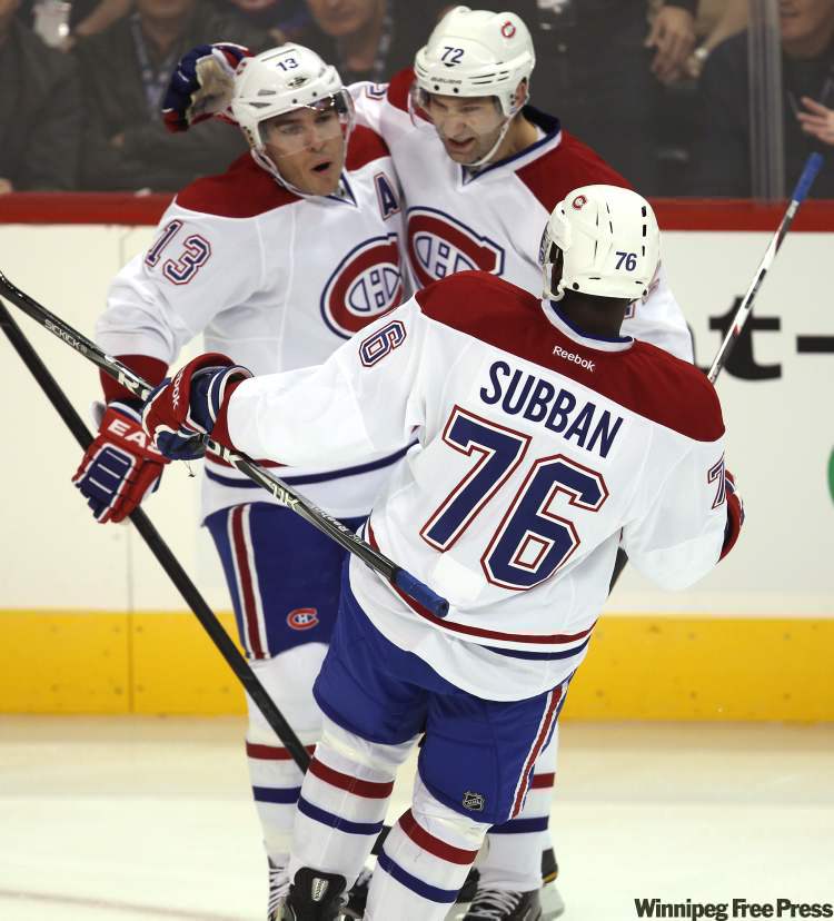 Joe Bryksa / Winnipeg Free Press
Canadiens Michael Cammalleri (13), Erik Cole and P.K. Subban celebrate Cammalleri's opening goal.