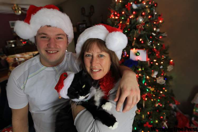 JOE.BRYKSA@FREEPRESS.MB.CA
Andrea Santa with son, Christian, and cat, Boots. Santa is a Spanish surname dating back hundreds of years.