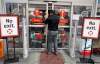TREVOR HAGAN / WINNIPEG FREE PRESS
Store manager Roger San Miguel checks on customers at the Future Shop on Leila Avenue at around 5:30 a.m. The store opened at 6 a.m. for Boxing Day.