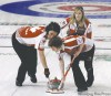 Ahn Young-joon / the associated press
Three members of Canada's cardiac curlers, sweepers Jill Officer (left) and Dawn Askin and skip Jennifer Jones play Sweden in a do-or-die game Friday.