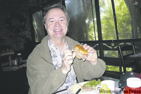 KEVIN ROLLASON / WINNIPEG FREE PRESS
Chowing down on a cheeseburger on Cabbage Key.