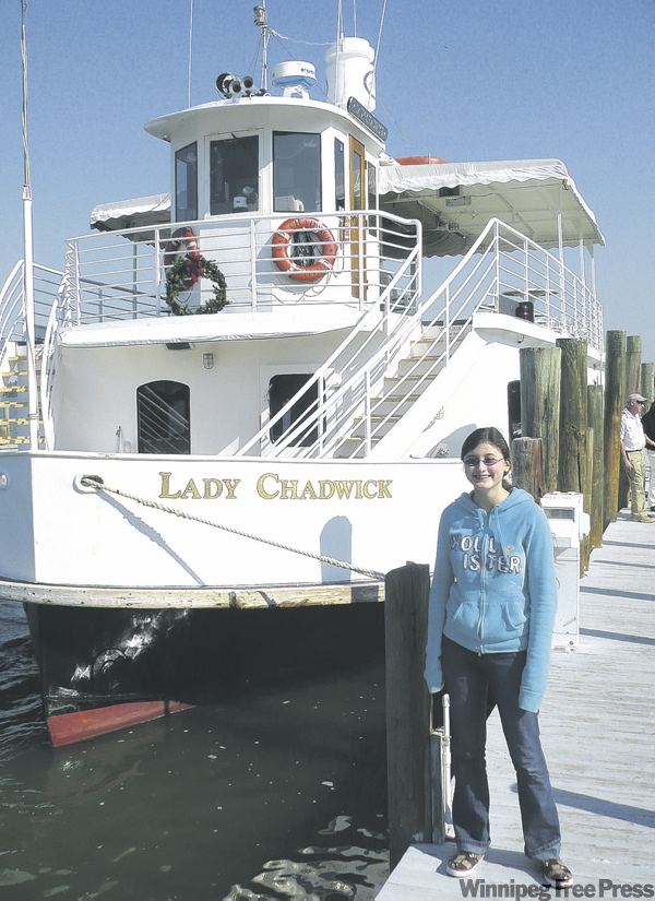 KEVIN ROLLASON / WINNIPEG FREE PRESS
Sarah Rollason-MacAulay in front of the boat that takes you from Capitva Island to Cabbage Key daily.