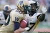 John Woods / The Canadian Press
Winnipeg Blue Bombers' Brock Ralph straight-arms Hamilton Tiger-Cats' Jerome Dennis in first half CFL action in Winnipeg, Friday, July 2, 2010.