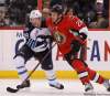 Jean Levac / Ottawa Citizen
Zenon Konopka (R) of the Ottawa Senators is held by Tobias Enstrom (penalty on the play) of the Winnipeg Jets during the third period of NHL action in Ottawa Monday.