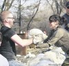 KEN GIGLIOTTI / WINNIPEG FREE PRESS 
Tobin Dyck hands a sandbag to Cathy Gerbasi behind a home on Scotia Street.