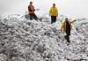 JOE.BRYKSA@FREEPRESS.MB.CA 
Workers at the Kapyong Barracks in Winnipeg prepare more than 600,000 sandbags, which will be sent west to help fight the flood on the Assiniboine River.
