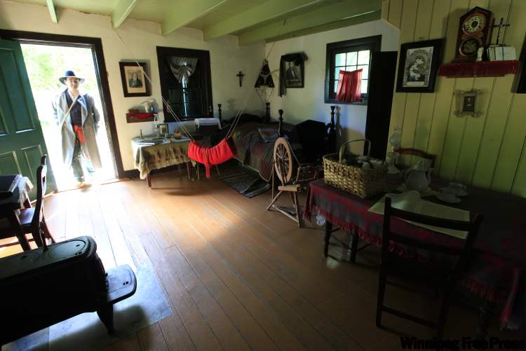 JOHN.WOODS@freepress.mb.ca
Quillan Daniel, a historical interpreter at Riel House, enters the residence in period dress.