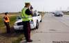 KEN GIGLIOTTI / WINNIPEG FREE PRESS
Winnipeg Police Service Sgt. Mark Hodgson (left) and Sgt. Lou Malo monitor vehicles' speeds on Bishop Grandin Boulevard, where drivers were clocked going at least 50 kilometres per hour over the 80 km/h limit.