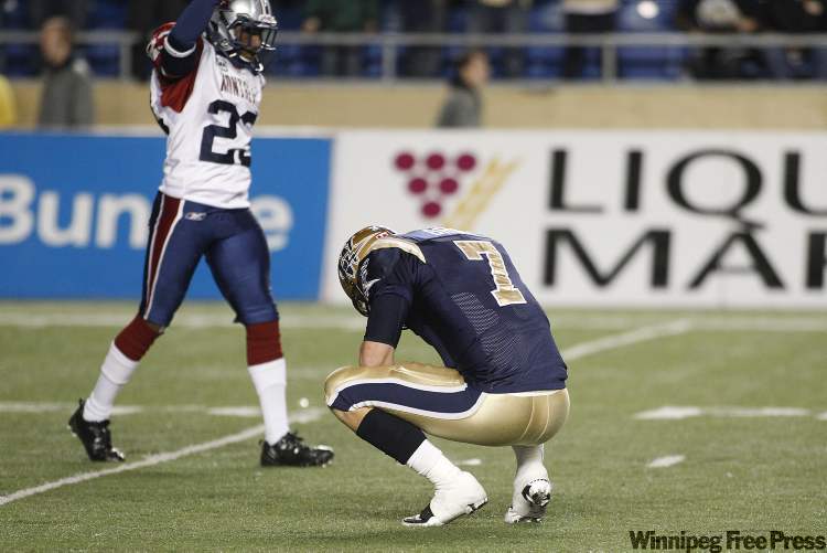 JOHN WOODS / WINNIPEG FREE PRESS
Winnipeg Blue Bombers' Alex Brink (7) looks dejected following the team's defeat by the Montreal Alouettes in Winnipeg Friday. Winnipeg lost to Montreal 26-32.