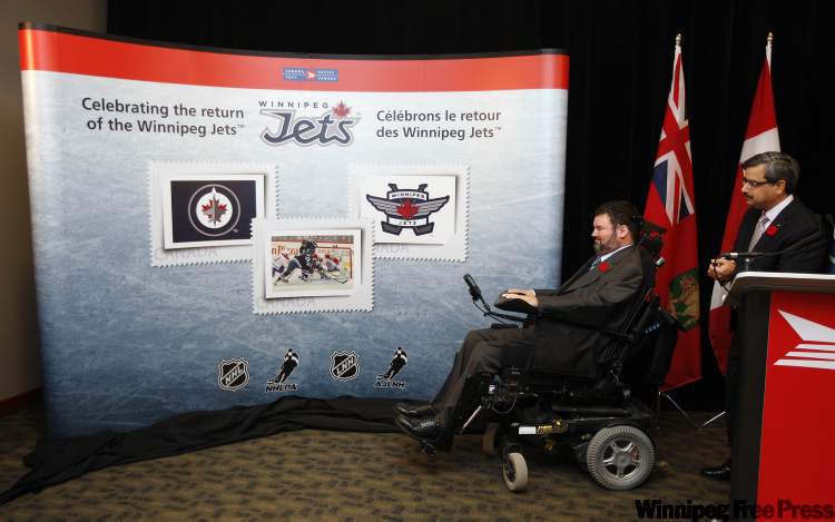 KEN GIGLIOTTI / WINNIPEG FREE PRESS
MP Steven Fletcher, left, was on hand with Canada Post president and CEO Deepak Chopra at the MTS Centre to unveil three new postage stamps featuring the Winnipeg Jets.