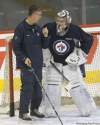 JOE BRYKSA / WINNIPEG FREE PRESS
Noel speaks to  goaltender Ondrej Pavelec at practice on Wednesday.