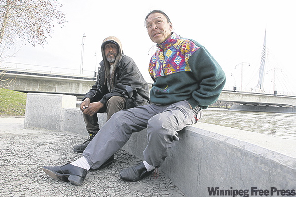BORIS MINKEVICH / WINNIPEG FREE PRESS
Faron Hall (right) and friend Wayne Spence at the Provencher Bridge.
Hall is being hailed for his heroic rescue of a teenage boy near the bridge.