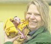 COURTESY OF CITY OF WINNIPEG
Zookeeper Jacquie Randall cradles four-month-old Rooby, a red kangaroo that was prematurely expelled from its mother’s pouch at the Assiniboine Park Zoo. Staff has been feeding the little one every three hours and it seems to be working