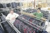 WAYNE.GLOWACKI@FREEPRESS.MB.CA
Richlu Manufacturing vice-president Gavin Rich (left) and distribution manager Ricky Duong. The company’s workwear is sold worldwide.