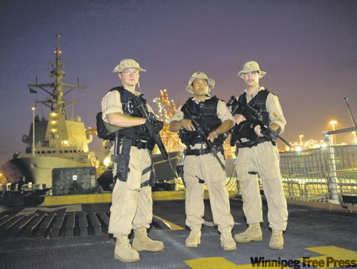 Cpl. Rick Ayer, Formation Imaging Services
Members of HMCS Winnipeg's naval boarding party look out over Karachi Harbour, Pakistan, last month.