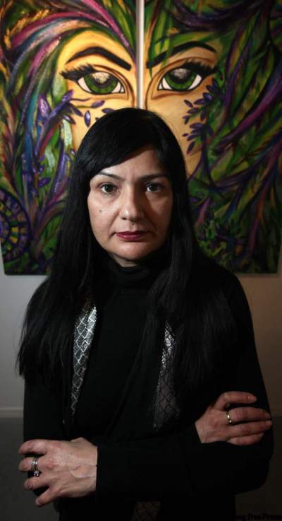 Phil Hossack / Winnipeg Free Press 
Bhavni Bhakoo poses in front  of her painting Rest-or-Me.