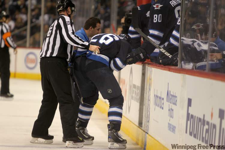 Ruth Bonneville / Winnipeg Free Press
Winnipeg Jets' Blake Wheeler is helped off the ice after he was injured in the second period during Saturay's game against the New Jersey Devils. The Devils won the game 2 to 1.