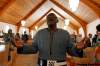 TREVOR HAGAN / WINNIPEG FREE PRESS
Rev. Joseph Seidu sings and sways during services at Crestview Park Free Methodist  on a recent Sunday. Lindor Reynolds visited the small St. James house of worship that is  home to many newcomers.