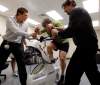 KEN GIGLIOTTI /  WINNIPEG FREE PRESS
GEoff Kirbyson takes the tough Wingate test, a maximum effort bike sprint as Brand Gerbrandt, left, and Jeff Leiter give encouragement  as they administer the test .