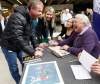 KEN GIGLIOTTI / WINNIPEG FREE PRESS
Hockey great and former Winnipeg Jet Bobby Hull (right) signs a copy of his book, The Golden Jet, for Kent Robinson in Winnipeg Square. Robinson was visited by Hull when he was suffering from cancer in a Health Sciences Centre Children's Hospital ward, at age 9, 30 years ago.