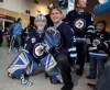 TREVOR HAGAN / WINNIPEG FREE PRESS
Cody Creasy, 8, with his dad, Shaun, from Brandon believe the Winnipeg Jets will make the playoffs, and Cody is ready to help out.