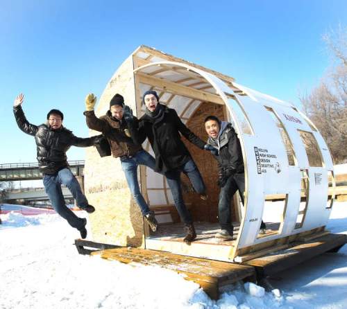JOE BRYKSA / WINNIPEG FREE PRESS Archives
Kelvin High School students jump out of their warming hut that they designed and built for The Forks river Trail.