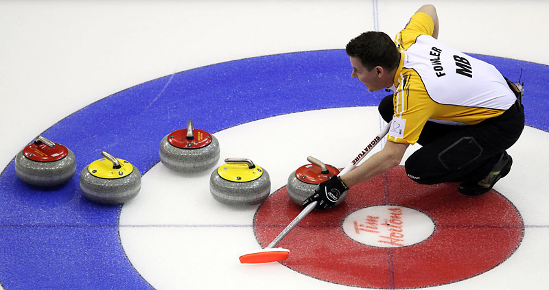The Canadian Press
Manitoba skip Rob Fowler carefully watches the line with a cluster of rocks in the house on Wednesday afternoon.