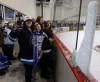 KEN GIGLIOTTI /  WINNIPEG FREE PRESS
Spectator Gabrielle Bruce got a surprise souvenir at the end of Winnipeg Jets practice after a Dustin Byfuglien blast broke the glass. It was a spirited intrasquad scrimmage in front of hundreds of school kids and fans at MTS Iceplex.