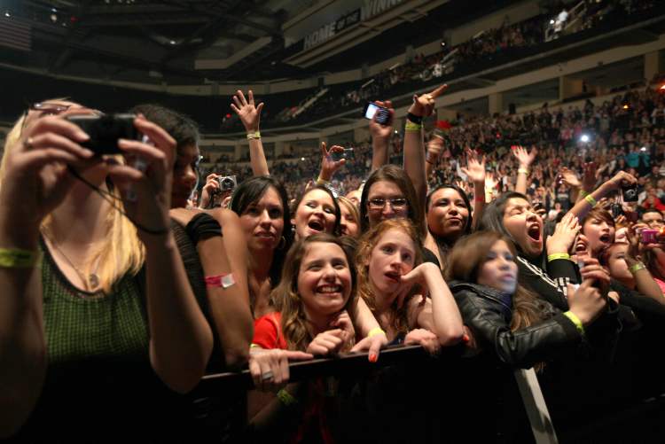Ruth Bonneville / Winnipeg Free Press
The crowd enjoys Pitbull Saturday at the MTS Centre.