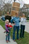 Boris Minkevich / Winnipeg Free Press
FROM LEFT: Mike Smith, Mona Neufeld and Esther Epp-Tiessen hold oil drum they will parade down Portage Avenue. Laurel Smith holds Elias Neufeld.