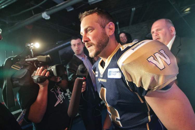 Mike Deal / Winnipeg Free Press
Winnipeg Blue Bombers quarterback Buck Pierce talks to the media wearing the new jersey at the unveiling in the Pan Am Boxing Club.