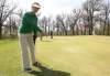 Betty Grant points out a subtle break on the green during a game with friends at the  Windsor Park Municipal Golf Course.