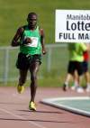 TREVOR HAGAN / WINNIPEG FREE PRESS FILES
2012 Mens full marathon winner, Thomas Omwega, nears the finish line at the University of Manitoba.