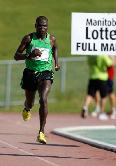 TREVOR HAGAN / WINNIPEG FREE PRESS FILES
2012 Mens full marathon winner, Thomas Omwega, nears the finish line at the University of Manitoba.