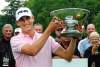 Mike Deal / Winnipeg Free Press
Chris Killmer from Bellingham, WA hoists the Players Cup after finishing on top on the final day at Pine Ridge.