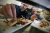 John Woods / Winnipeg Free Press
Deseo's owner and chef Scott Bagshaw, left, and sous chef Mike Robins plate young chicken and seared scallops.