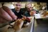 John Woods / Winnipeg Free Press archives
Scott Bagshaw, chef and owner of Deseo (left), and his sous-chef Mike Robins put the finishing touches on some young chicken and seared scallops.