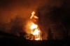 Boris Minkevich / Winnipeg Free Press
The fire in the St. Boniface-area industrial park is seen after dark.