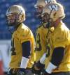 Joe Bryksa / Winnipeg Free Press
Winnipeg Blue Bombers quarterback Joey Elliott, left with quarterbacks Justin Goltz, center, and RJ Archer at practice Thursday morning at Canad Inns Stadium in Winnipeg